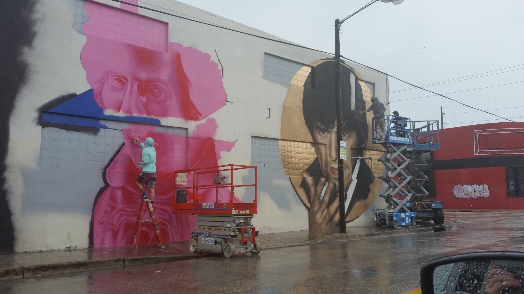 Beethoven and Scar Face Murals going up by Cyrcle and Drew Merritt work in the rain