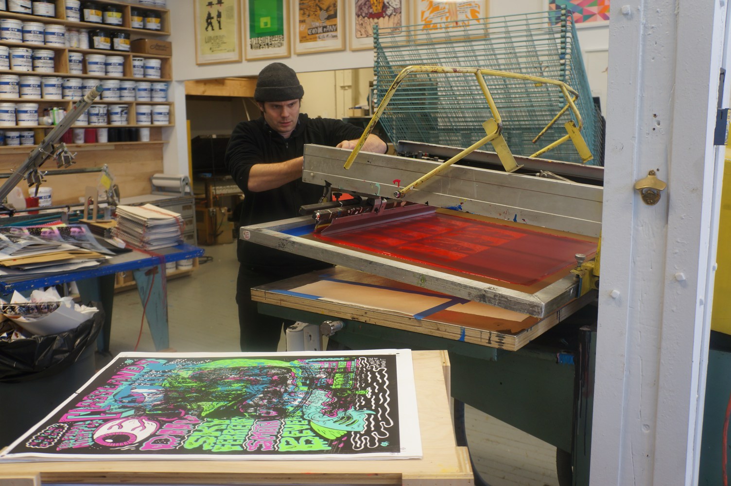 The Second Layer of the Screen Print. Red dye being pressed into the already blue print.