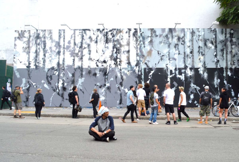 Futura sits in front of the newly finished Bowery Wall