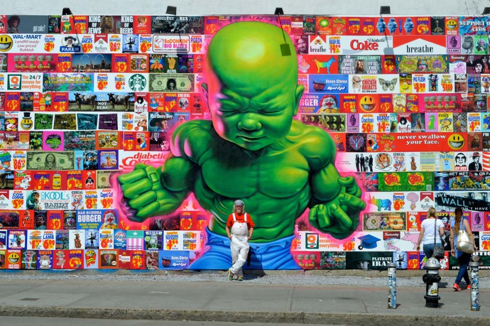 Ron English in front of the Newly created Bowery Wall