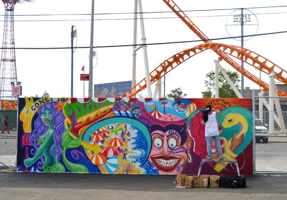 Lady Pink working on her wall outside the Coney Island Boardwalk