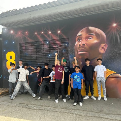 a group of people standing in front of a building