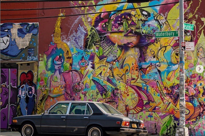 colorful graffiti on the side of a road