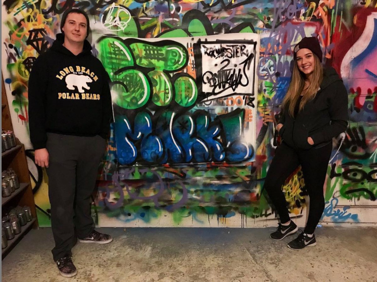 a group of people standing in front of a store