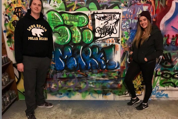 a group of people standing in front of a store