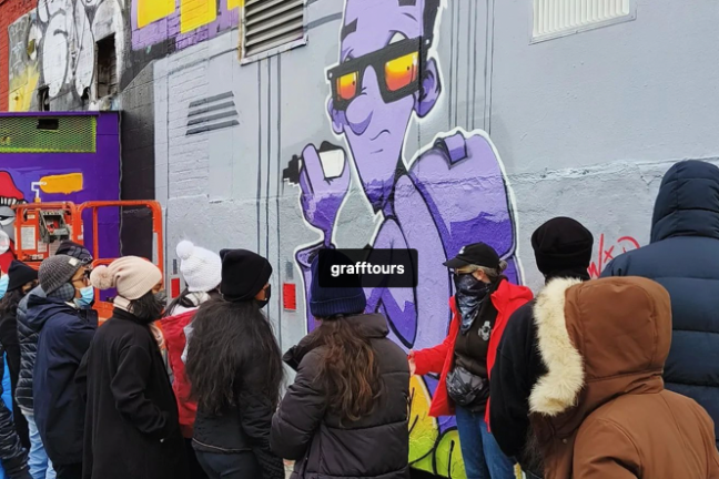 a group of people standing in front of a crowd