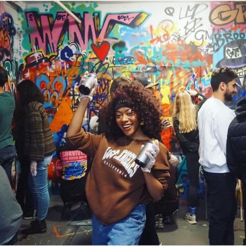 a group of people standing in front of a store