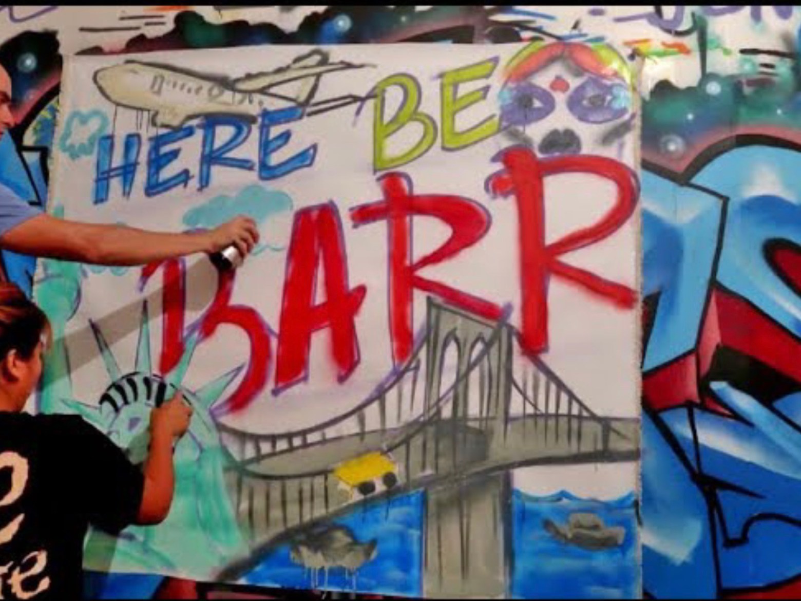 a man with graffiti on the wall